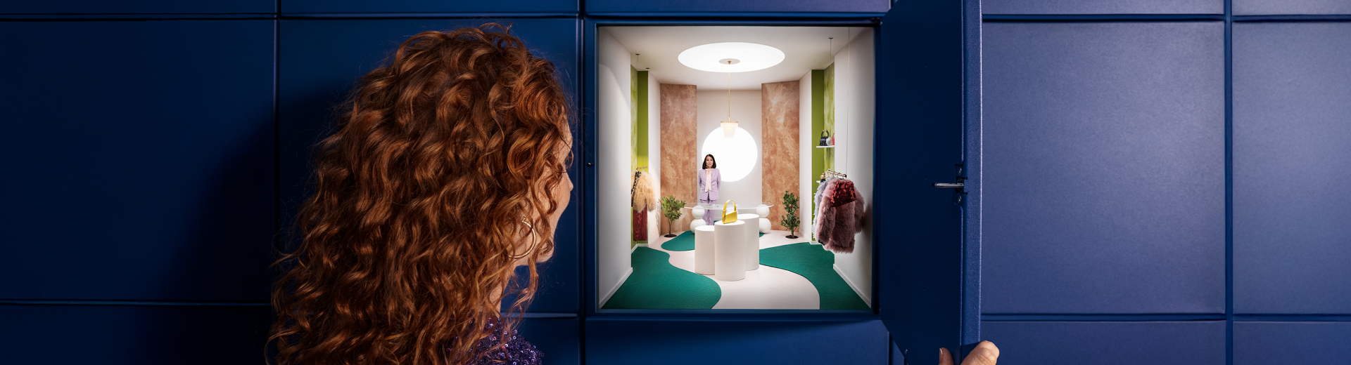 Woman opens a parcel locker, which reveals a view of the store and the online retailer's GLS pick-up points.