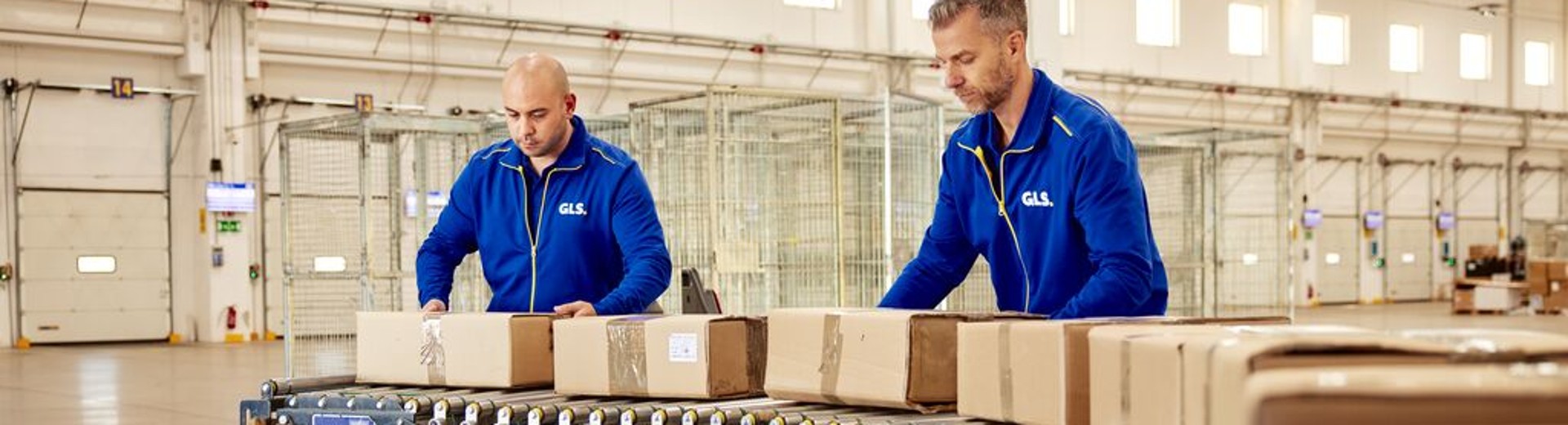 Two employees working on a conveyor belt