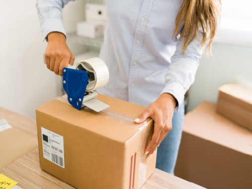 Woman receiving a GLS parcel at her place