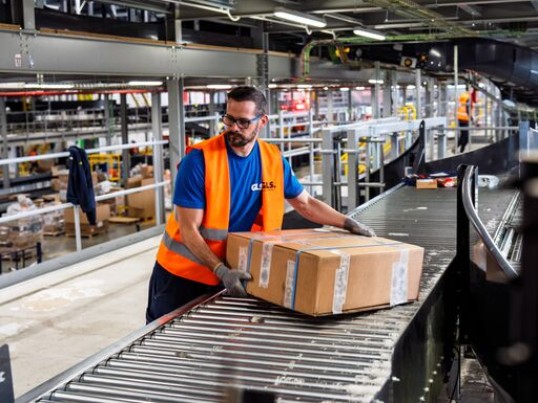 GLS trainee working on a night loading and sorting parcels