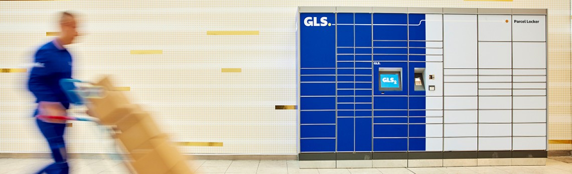 A courier takes packages to the GLS Parcel locker