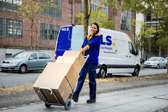 GLS delivery woman and GLS delivery van