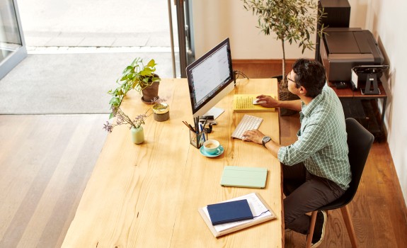 man in the office in front of computer 