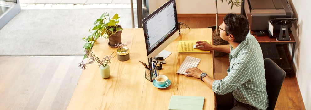 man in the office in front of computer 